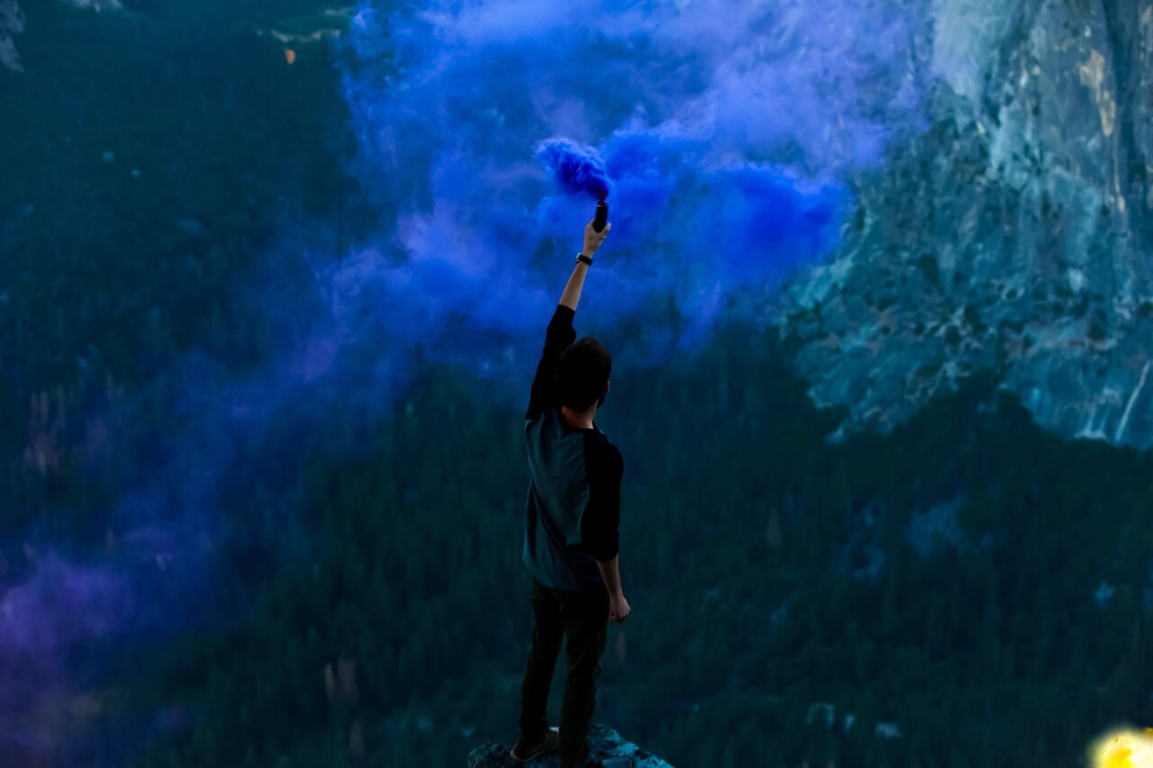 Man with blue spray