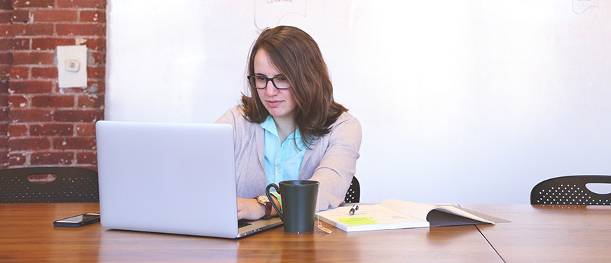 Business woman looking at a laptop