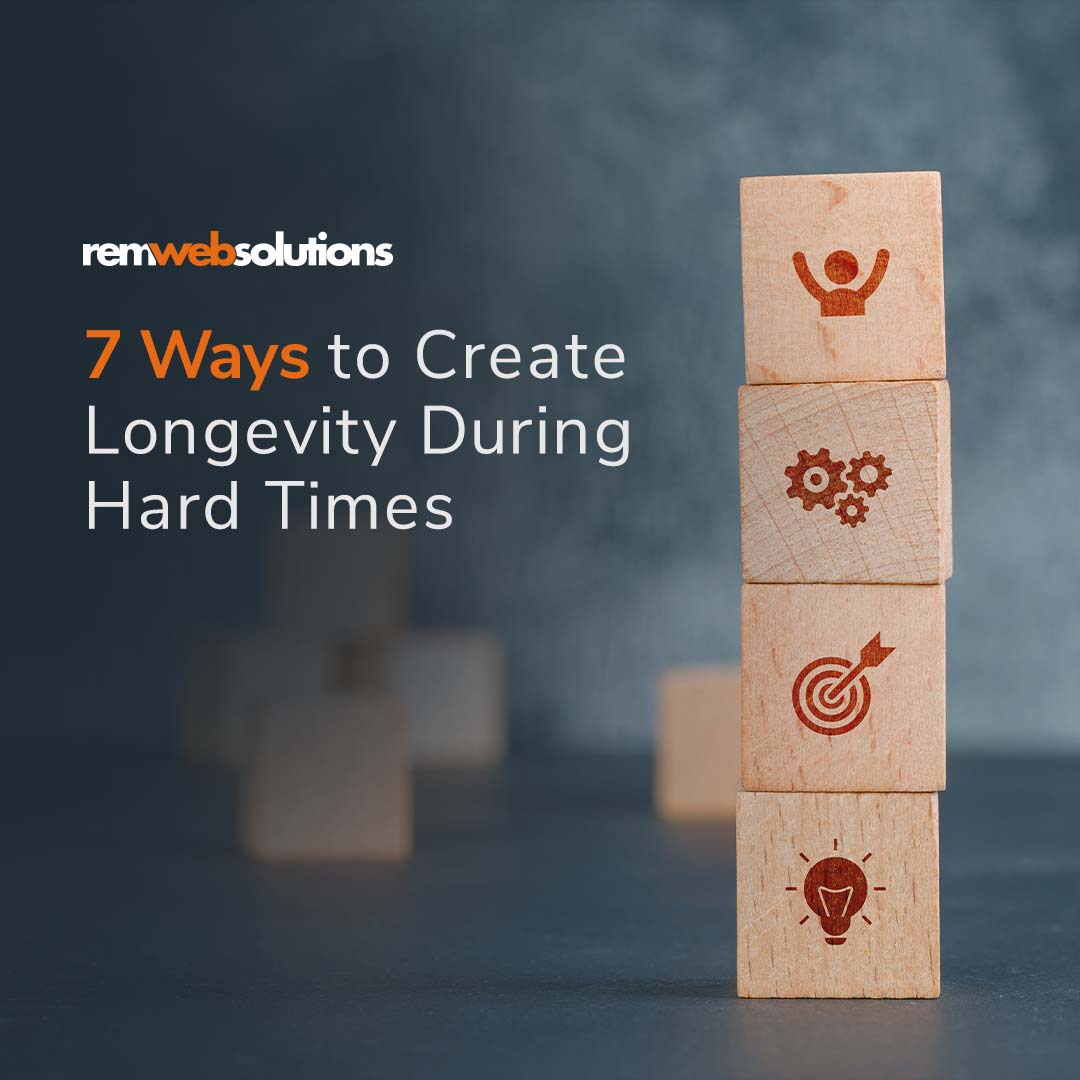 A stack of wooden blocks with business icons on it