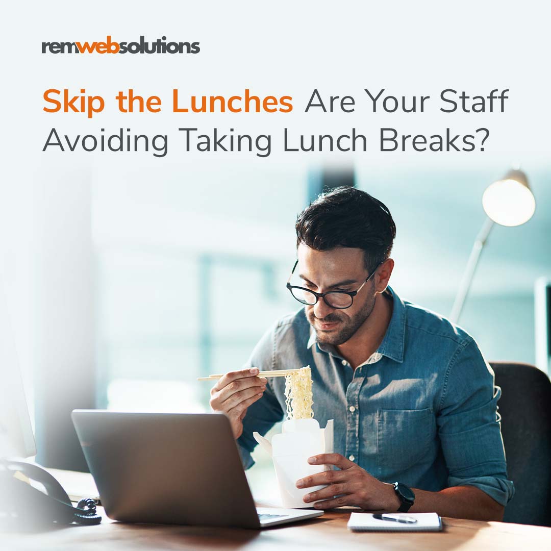 Man working and eating lunch on his office desk