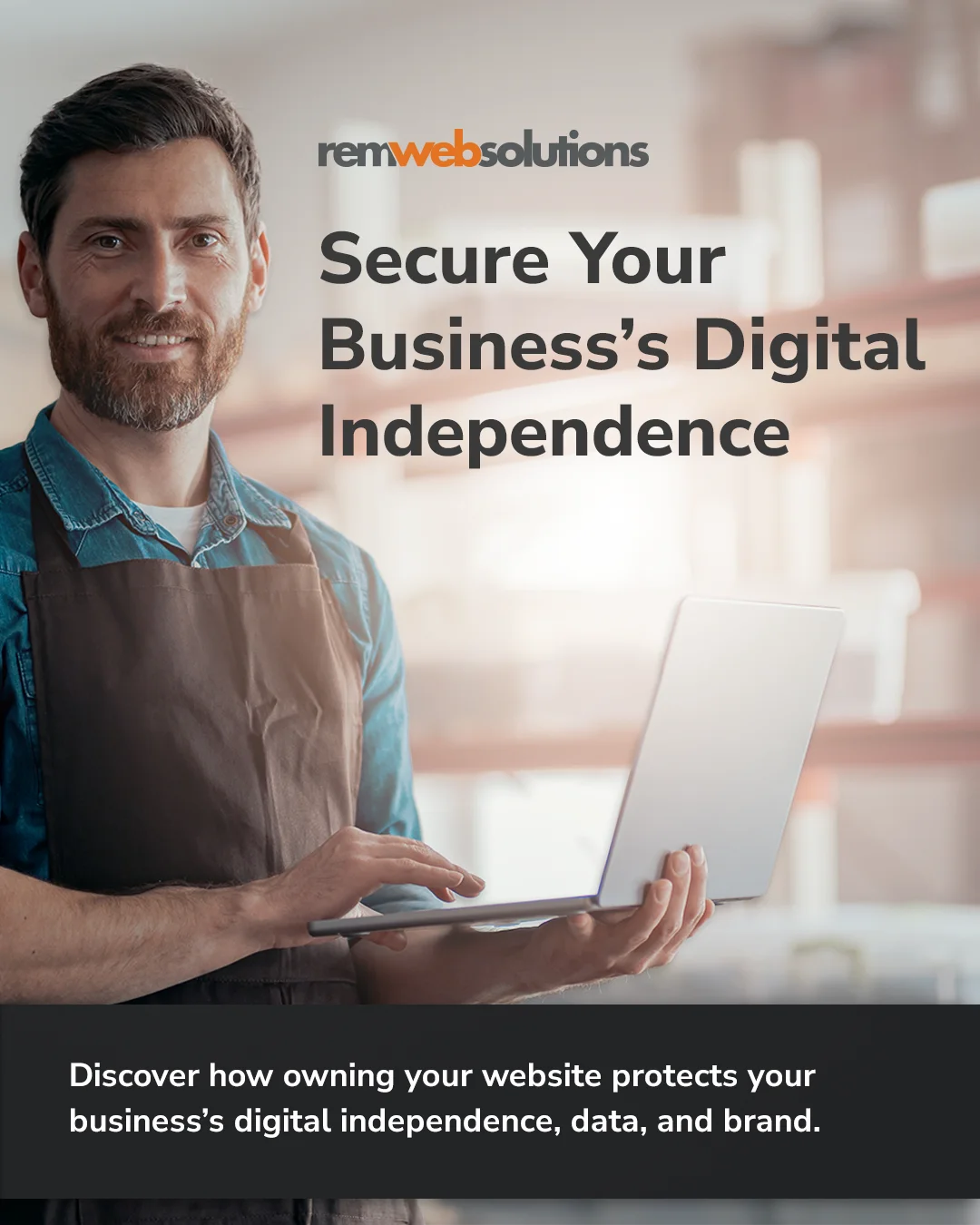 Business owner holding laptop in warehouse