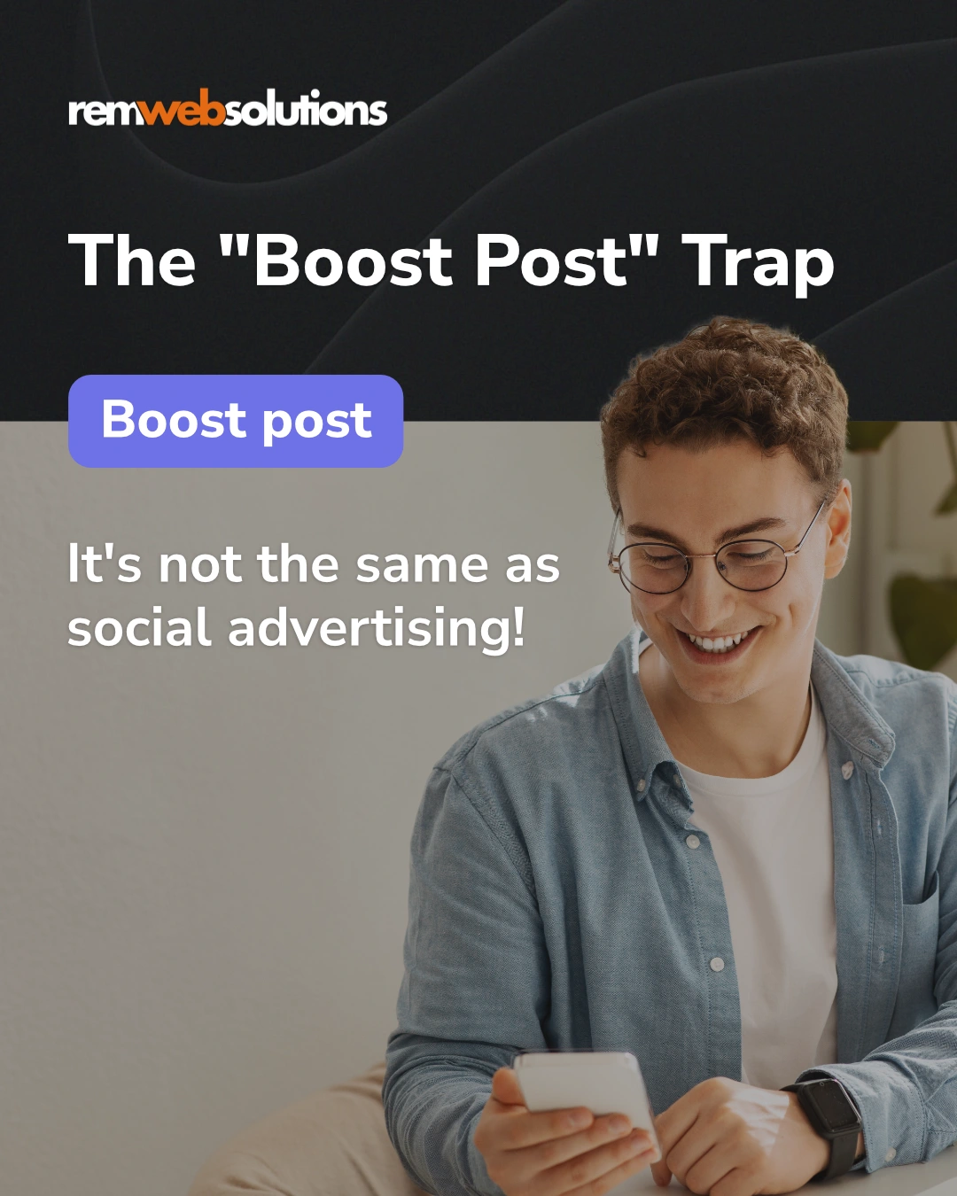 Man smiling at mobile phone