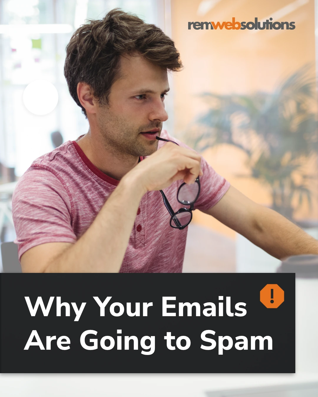 Man in office setting looking at desktop computer