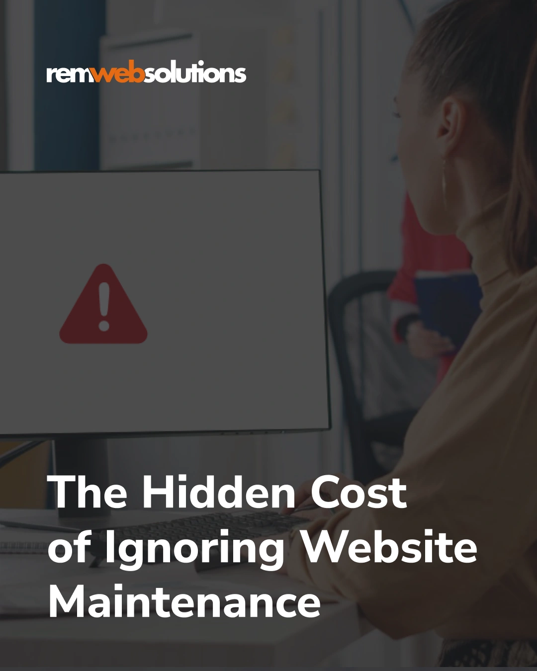 Woman looking at monitor with error icon on screen