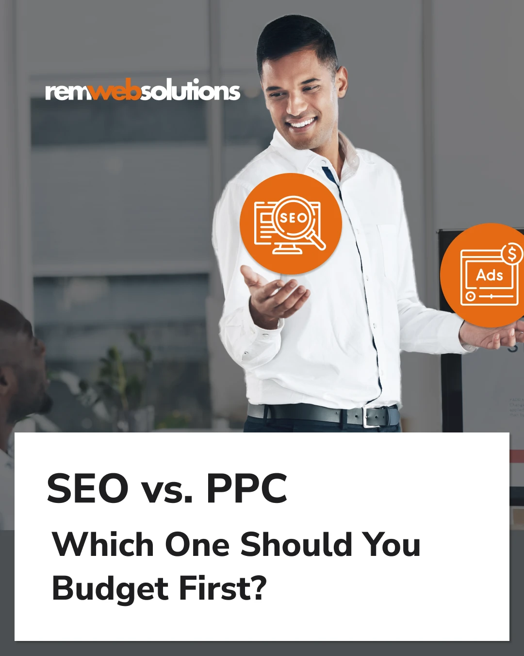 Man holding SEO icon and Google Ads icon in office setting